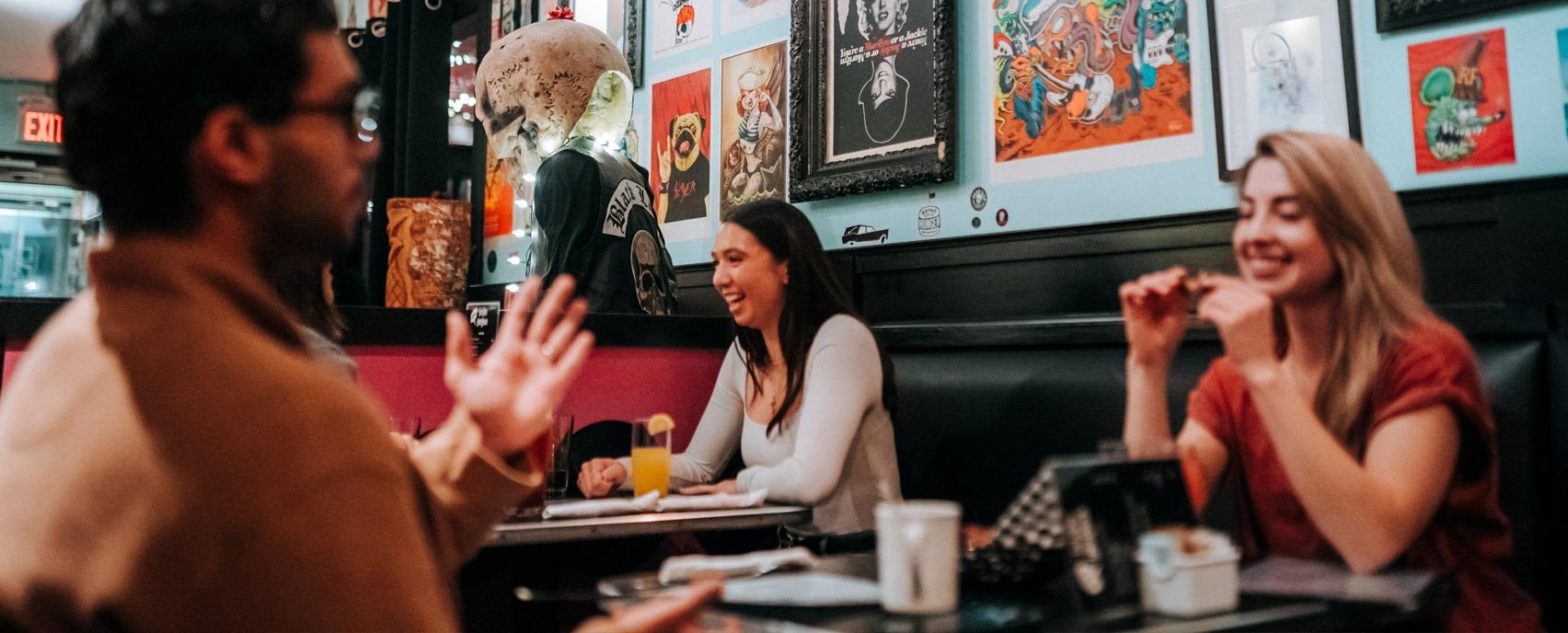 Students gathered in a diner in London, Ontario eating and conversing.