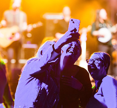 audience watching a band on stage