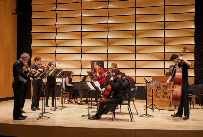 A group of musicians performing on the stage.