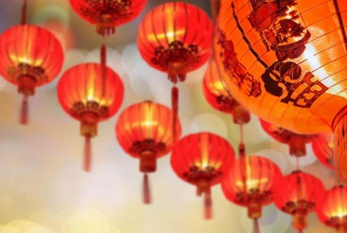 Orange Chinese lanterns hanging on the ceiling.