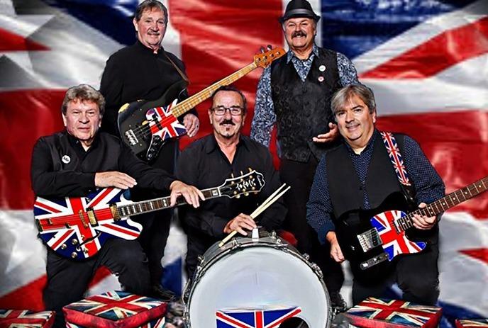 Five band members with their instruments posing for a picture under British flag themed background.