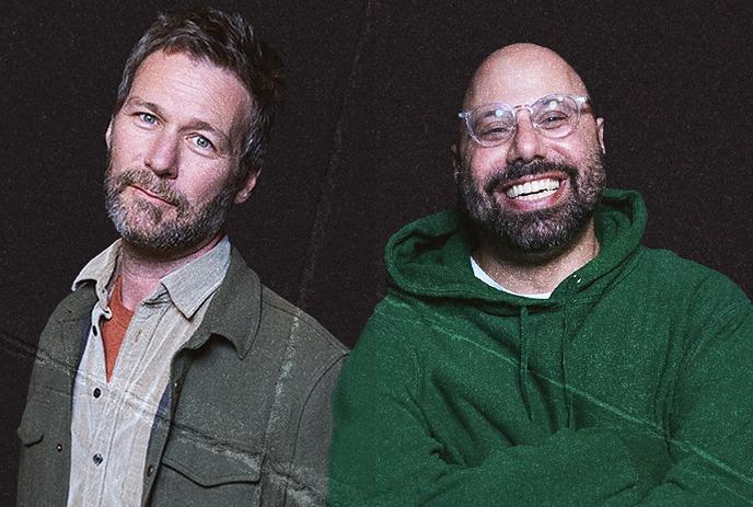 Jon Dore & Dave Merheje posing for the camera in front of white backgrounds.