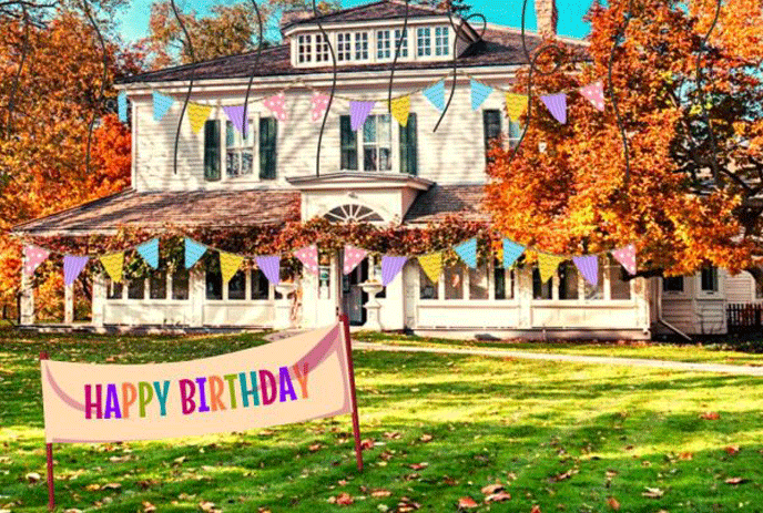 Eldon House with a happy birthday sign in front of it.