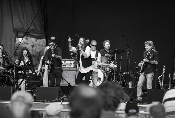 A black and white photo of Forever Seger performing on stage.