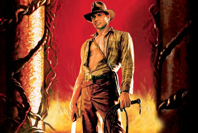 An action figure of an adventurer in classic outfit with whip and machete, fiery backdrop with vines and pillars.