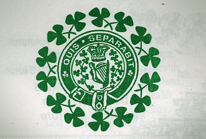 Green emblem with the text ‘QUIS SEPARABIT’ surrounded by shamrock leaves.