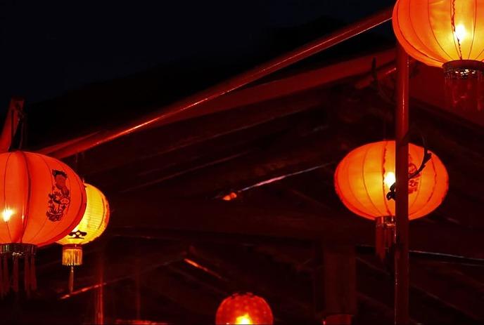 Chinese lanterns glowing in the dark.