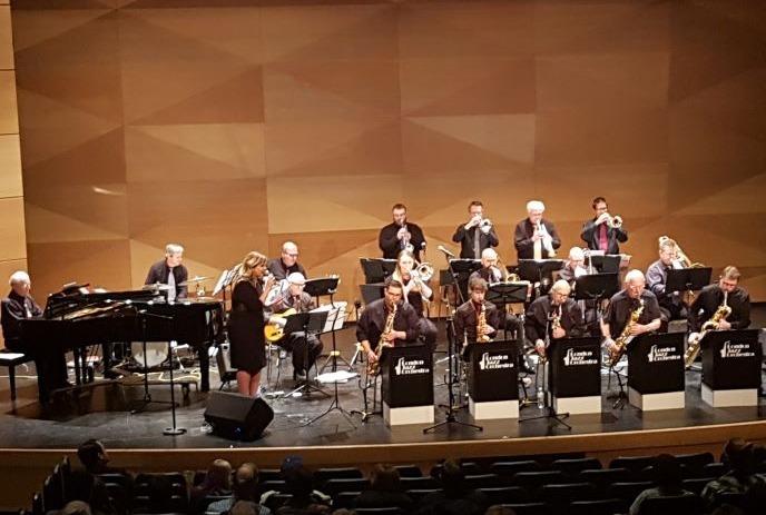 The London Jazz Orchestra performing on stage in front of an audience.