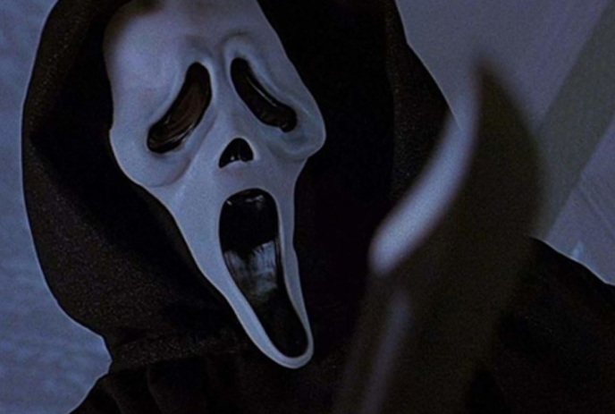 Poster of the movie ‘Scream’ featuring the iconic ghost face mask in a hoddie.