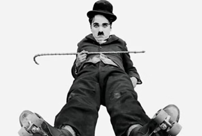 An iconic image of Charlie Chaplin! Known for his timeless silent films and signature bowler hat, mustache, and cane.