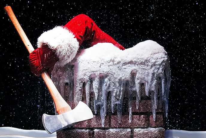 A Santa Claus arm holding an axe rests on a snow-covered chimney with icicles hanging down.