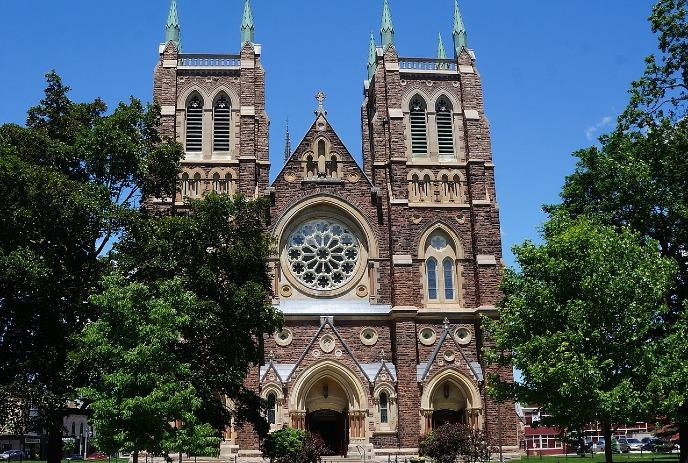 A Picture of St. Peter's Cathedral Basilica during a sunny day with clear blue sky.