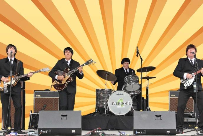 The Liverpool 4 performing on stage with a sunshine graphic background.