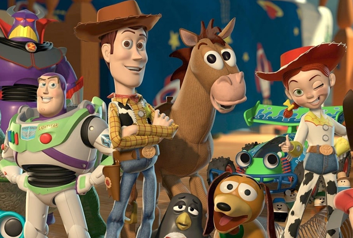 Buzz Lightyear, Woody, Jessie, Bullseye, Slinky Dog, and others, standing together in a playful setting.