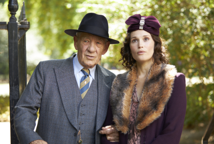 Two people in older period clothing looking forward to the camera.