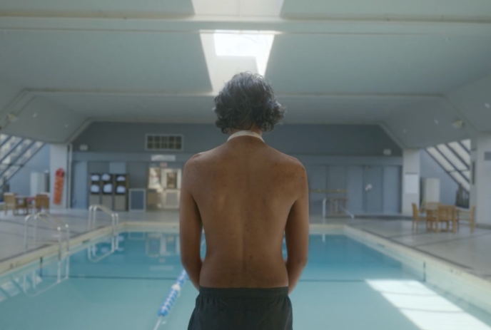 The view from a person standing in front of a swimming pool.