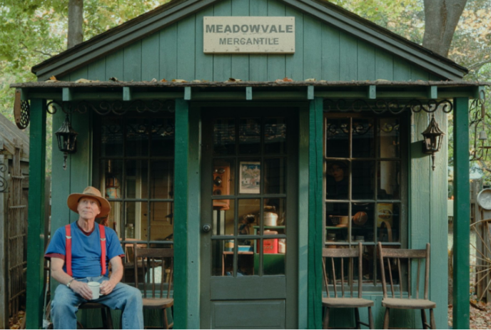 Person sitting in front of Meadowvale Mercantile Store.