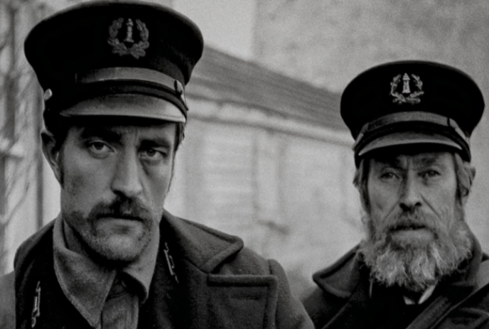 Two stern-looking Lighthouse Keepers looking at the camera.