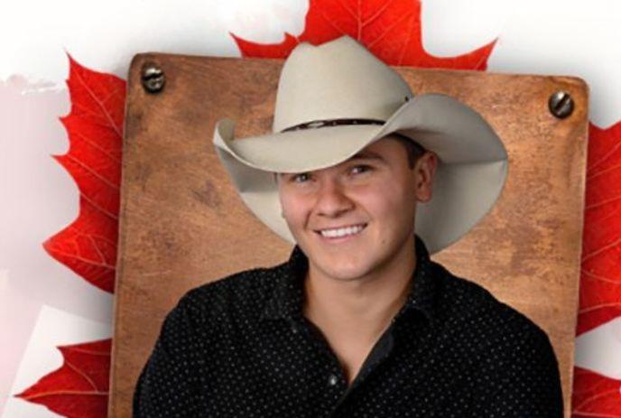 A person smiling in cowboy hat, maple leaves and wooden board in the background.