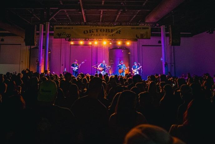 Whiskey Glasses: A Morgan Wallen Tribute performing live on stage in front of a crowd.