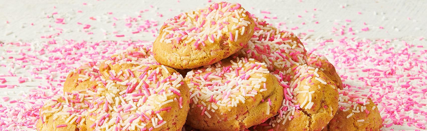 white and pink sprinkles on lots of cookies