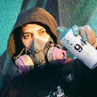 Derkz Holding a spray can