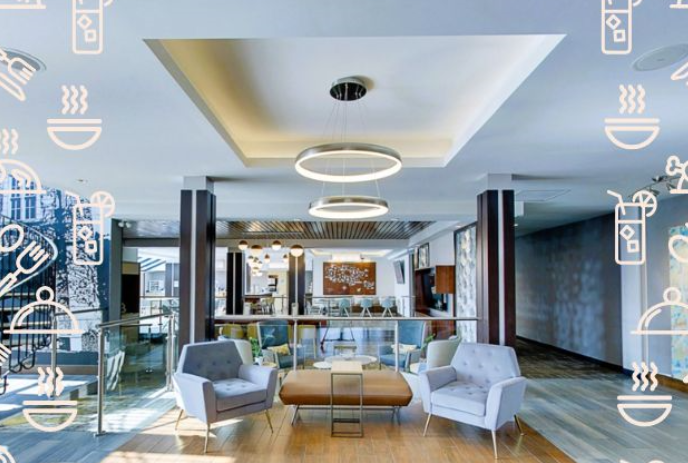 Two chairs and a table in a hotel lobby area.