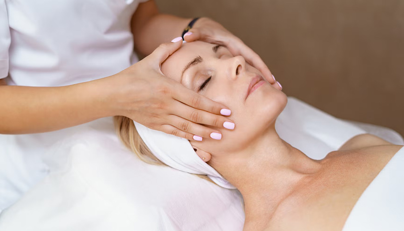 A woman being massaged on her head