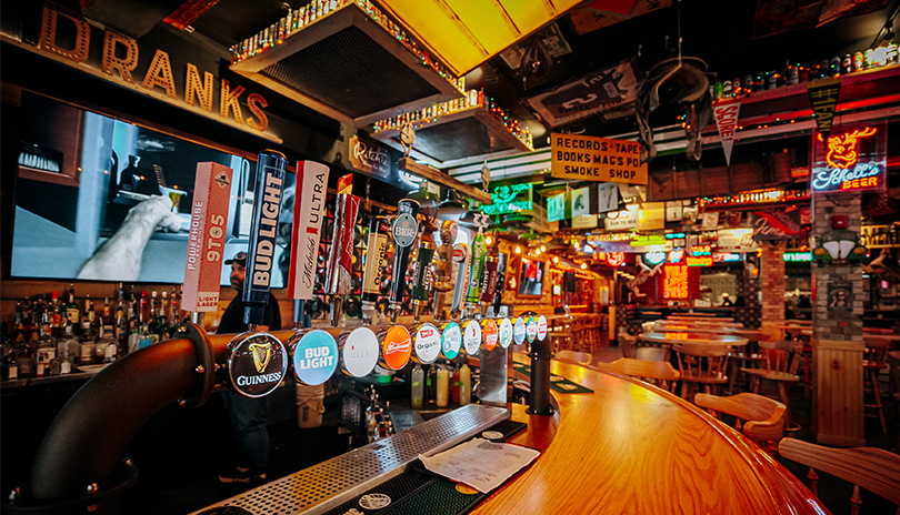 Inside shot of the bar, tables and seats at Burt's Bar in London, ON