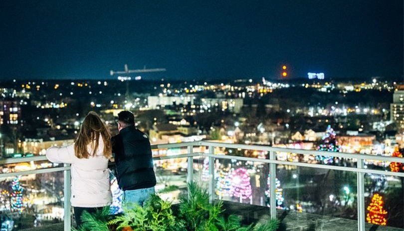 City Hall Obersation deck with a couple looking over the illuminated city