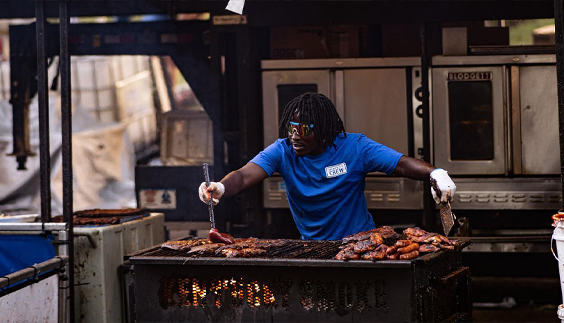 Man saucing up some hot ribs at London Rib fest