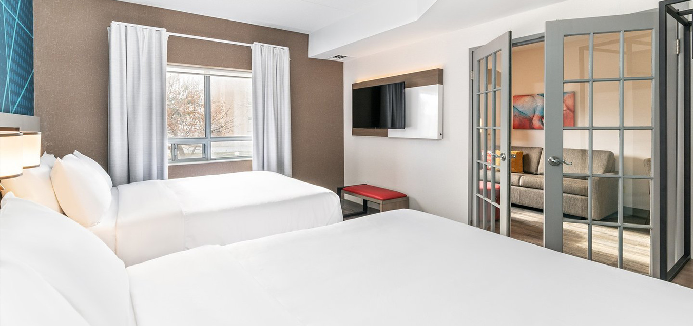 A hotel room bedroom suite located in London, Ontario